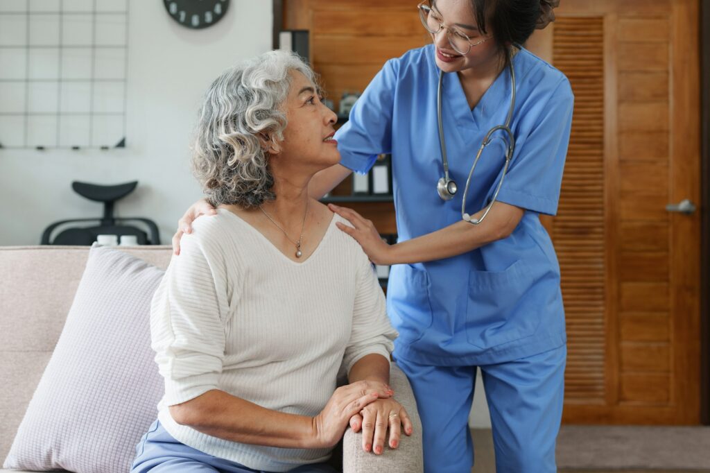 Asian youthful nurse caring for patients or the elderly at home. nursing at home concept