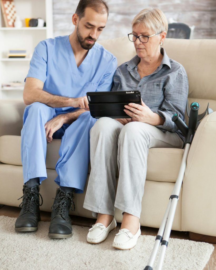 Senior woman with crutches in nursing home